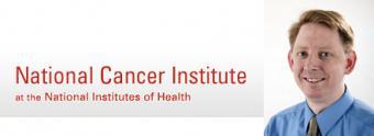Peter Burke picture with logo of National Cancer Institute